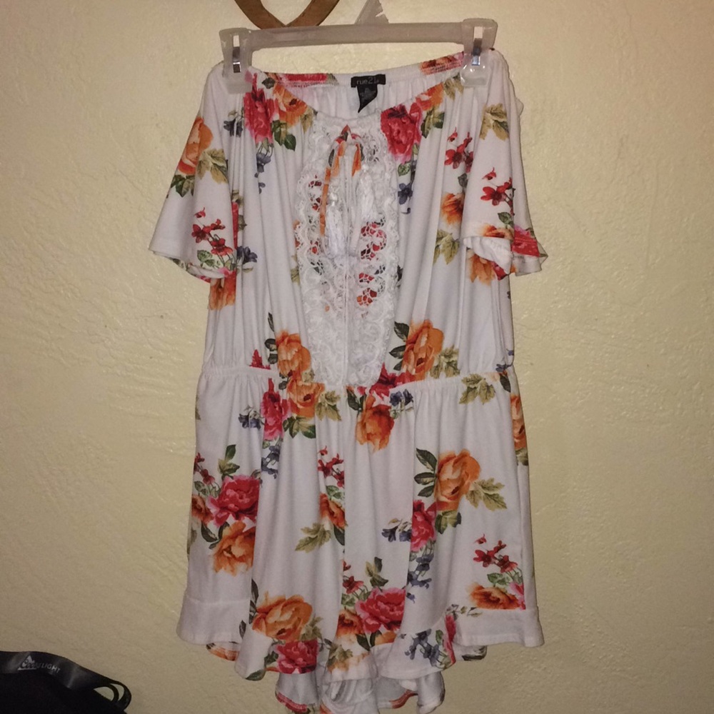 White floral off-the-shoulder romper with lace.